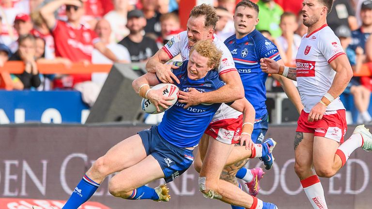 Wakefield's Lachlan Walmsley is tackled by Hull KR's Joe Burgess.