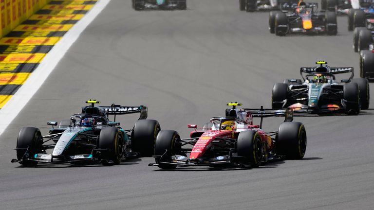 Ferrari driver Lewis Hamilton of Britain steers his car followed by Mercedes driver Andrea Kimi Antonelli of Italy and McLaren driver Lando Norris of Britain during the sprint race at the British F1 Grand Prix, in Silverstone, England, Saturday, July 4, 2026. (AP Photo/Darko Bandic)