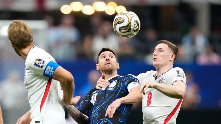 Argentina's Lionel Messi vies for the ball with England's Elliot Anderson (AP Photo/Rebecca Blackwell)
