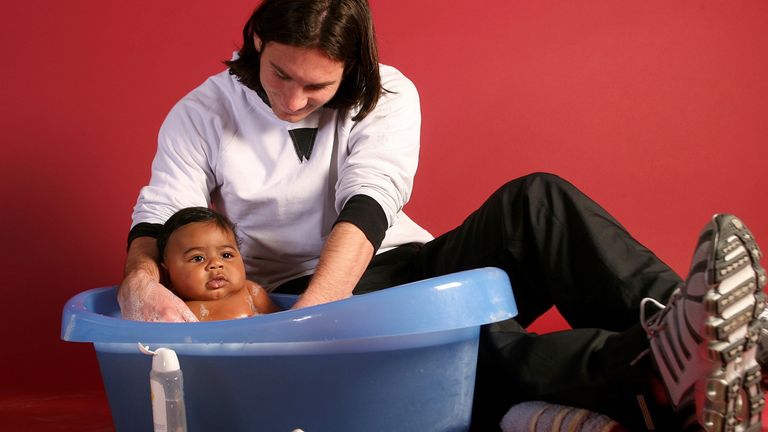 20-year-old soccer star Lionel Messi helps to bathe Lamine Yamal, who was merely six months old at the time, during a photo session in Sept. 2007 in the dressing room of the Camp Nou stadium in Barcelona, Spain. (AP Photo/Joan Monfort)
