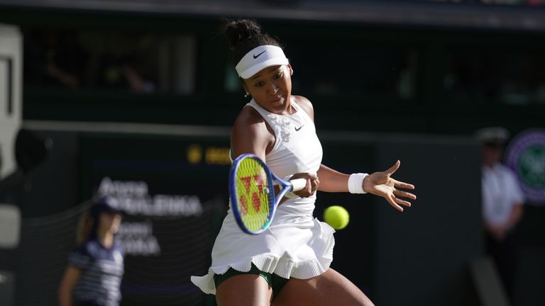 Naomi Osaka of Japan plays a forehand against Aryna Sabalenka of Belarus in their fourth round women's singles match at the Wimbledon Tennis Championships in London, Sunday, July 5, 2026. (AP Photo/Brian Inganga)