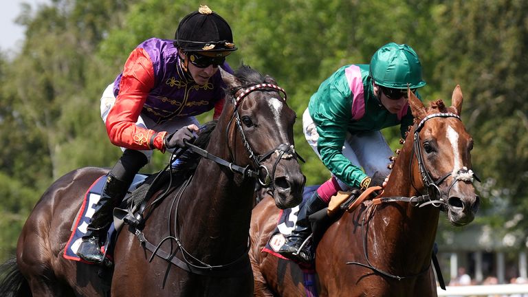 Point Of Law ridden by James Doyle (left) on their way to winning the Bahrain Trophy Stakes