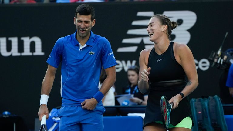 Serbia's Novak Djokovic and Aryna Sabalenka of Belarus react during an exhibition match against Stefanos Tsitsipas of Greece and compatriot Maria Sakkari ahead of the Australian Open tennis championships at Melbourne Park, Melbourne, Australia, Thursday, Jan. 11, 2024. (AP Photo/Andy Wong)