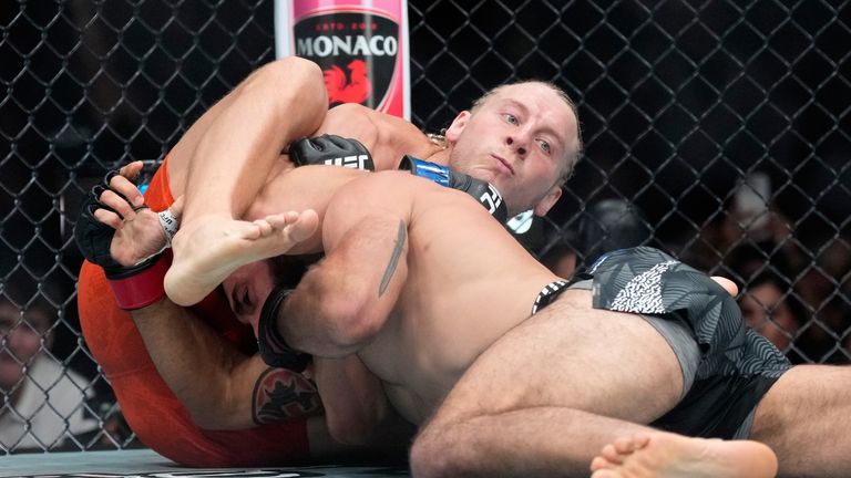 Paddy Pimblett submits Benoit Saint-Denis in a lightweight fight at UFC 329 in Las Vegas. (AP Photo/John Locher)