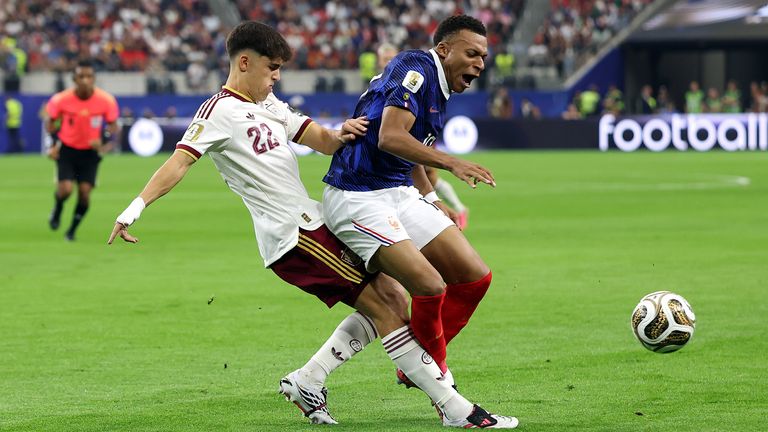 Spain's Pau Cubersi challenges France's Kylian Mbappe in the World Cup semi-finals.