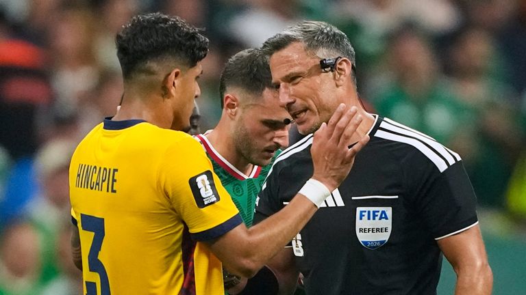 Referee Slavko Vincic of Slovenia speaks to Ecuador's Piero Hincapie (3) before sending him from the field during the World Cup round of 32 soccer match between Mexico and Ecuador in Mexico City, Tuesday, June 30, 2026. (AP Photo/Natacha Pisarenko)