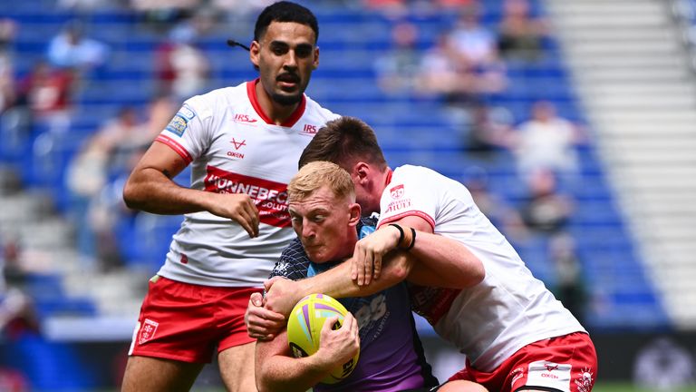 Picture by Olly Hassell/SWpix.com - 04/07/2026 - Rugby League - Betfred Super League Round 17: Magic Weekend - Hull KR v Hull FC - Hill Dickinson Stadium, Liverpool, England - Lennon Clark of Hull FC is tackled by Hull KR