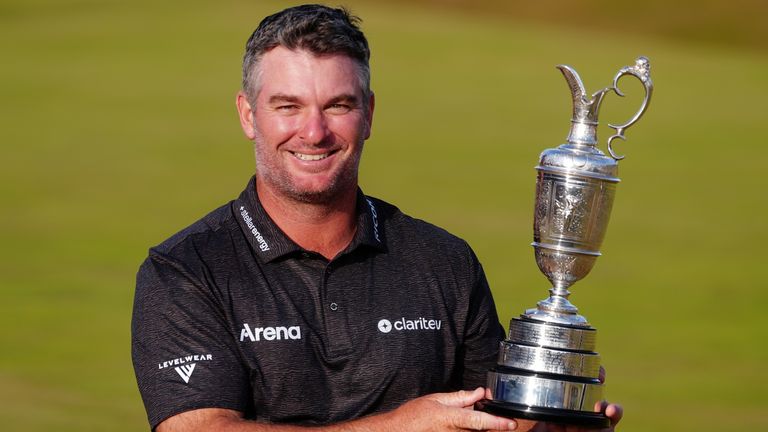 Fox proudly holds the Claret Jug