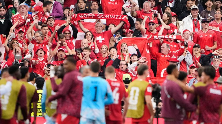 Swiss fans react to their team during the World Cup Round of 32 soccer match between Switzerland and Algeria, Thursday, July 2, 2026, in Vancouver, British Columbia. (AP Photo/Lindsey Wasson)
