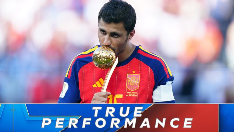 Rodri celebrates with the Golden Ball trophy