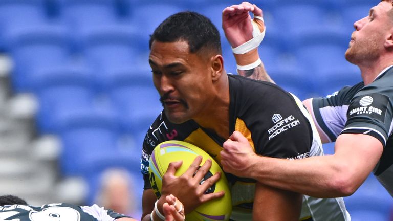 York's Toa Mata'afa crashes through the Huddersfield defence during the opening game of Super League Magic Weekend