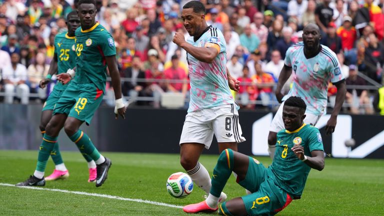 Senegal's Lamine Camara (8) fouls Belgium's Youri Tielemans to give away a penalty
