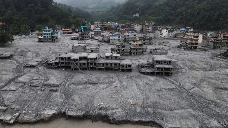 Houses were left covered in mud in Devighat, Nuwakot district. Pic: Reuters