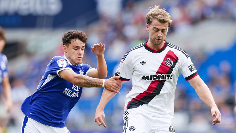 Alex Robertson of Cardiff City challenges Patrick Bamford of Sheffield United
