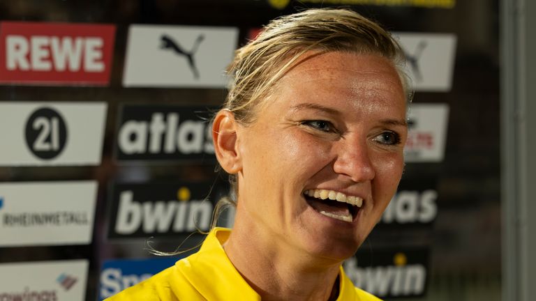 Popp speaking to reporters after scoring two goals on her Dortmund debut