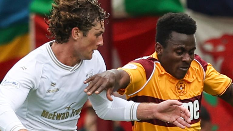 Falkirk's Ben Krauhaus (L) and Motherwell's Ibrahim Said in action at Fir Park