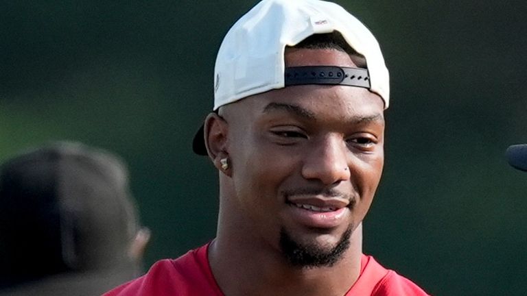 Atlanta Falcons running back Bijan Robinson (7) speak to a coach during a Atlanta Falcons training camp, Monday, Aug. 3, 2026, in Flowery Branch, Ga. (AP Photo/Mike Stewart)