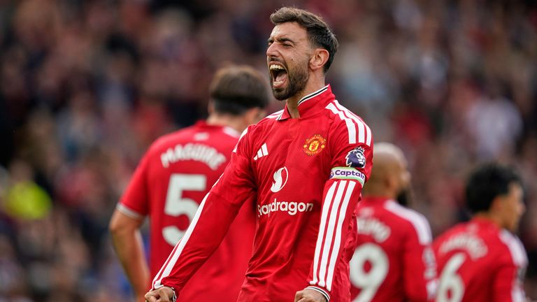 Bruno Fernandes celebrates after scoring his side's third goal (AP Photo/Dave Thompson)