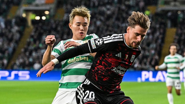 GLASGOW, SCOTLAND - AUGUST 19: Celtic's Hyunjun Yang (L) and LASK's Kasper Poul Molgaard Jorgensen (R) in action during a UEFA Champions League Play-Off Round first-leg match between Celtic and LASK, at Celtic Park, on August 19, 2026, in Glasgow, Sc