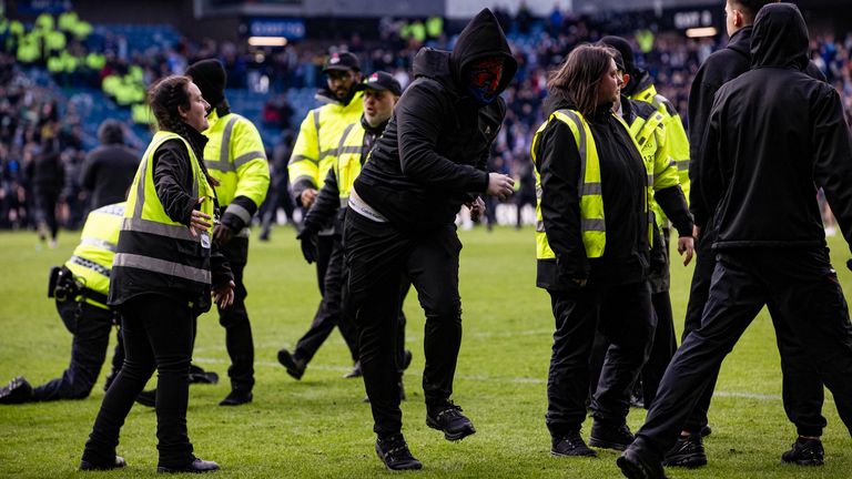 Fans stormed the pitch after last season's Scottish Cup tie at Ibrox