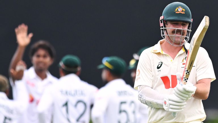 Australia's Travis Head walks off as Bangladesh players celebrate his wicket in Darwin