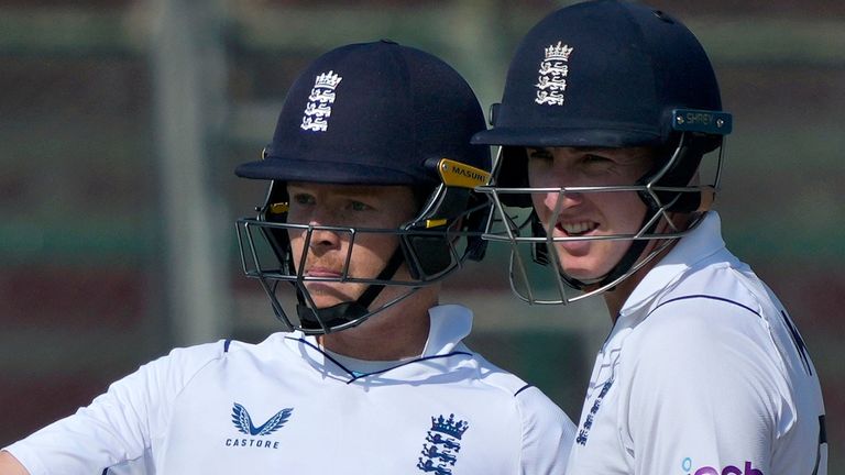 England's Ollie Pope, left, celebrates after scoring fifty against Pakistan as Harry Brook watches