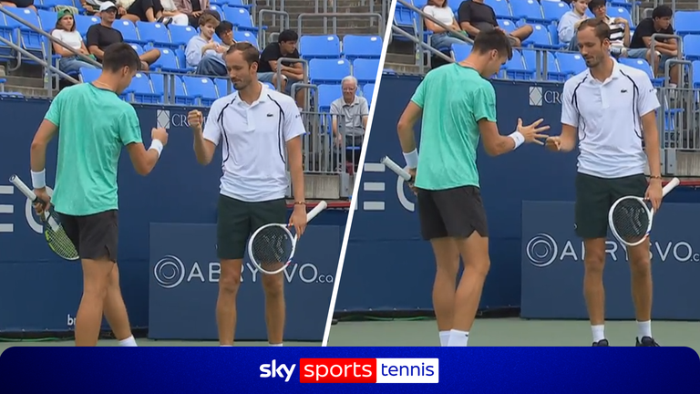 Daniil Medvedev and Fabian Marozsan play rock, paper, scissors to see who gets to serve the deciding point serve against Theo Arribage and A