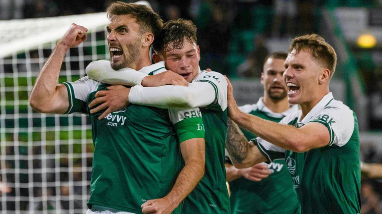 Warren O'Hora (L) celebrates after scoring to make it 2-1 to Hibs at Easter Road