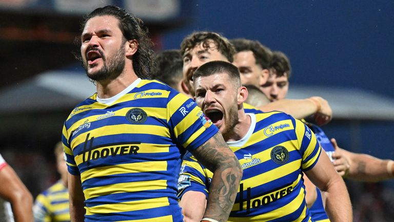 Warrington's James Bentley celebrates scoring a try against Hull KR along with Danny Walker.