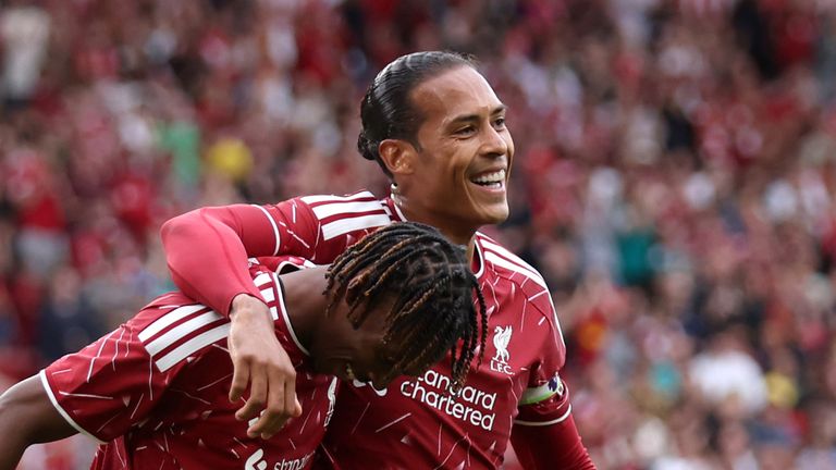 Jacquet celebrates with Virgil van Dijk after scoring