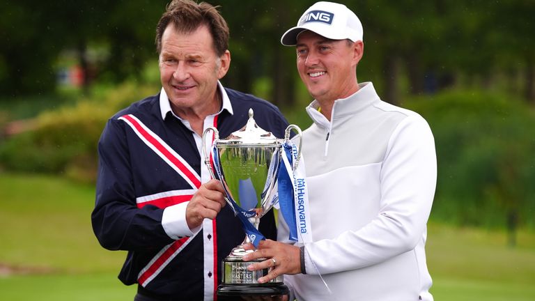 Winner Joe Dean of England (right) receives the trophy from Sir Nick Faldo after day four of the Husqvarna British Masters at The Belfry Hotel & Resort, Sutton Coldfield. Picture date: Sunday August 30, 2026.