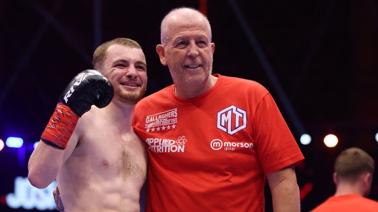 Joe Gallagher with one of his boxers Mikie Tallon - the 57-year-old coach hopes to return to training in October