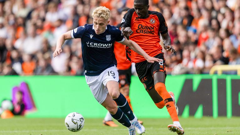  Dundee's Joe Westley (L) and Dundee United's Pan Camara in derby action