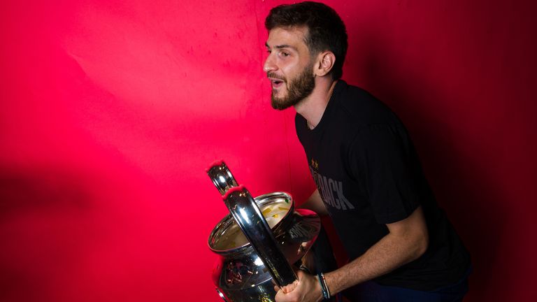 Paris Saint-Germain winger Khvicha Kvaratskhelia poses for a portrait with the UEFA Champions League trophy after the 2026 final