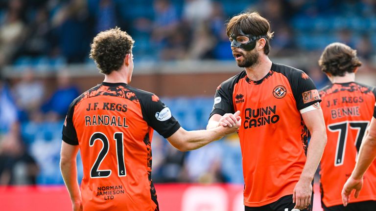 Dundee United's Jesse Randall (L) celebrates with Michael Forbes after scoring to make it 4-0 