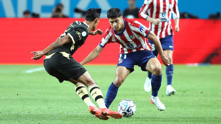 Obed Vargas of Atletico Madrid competes for the ball with Tijjani Reijnders of Manchester City
