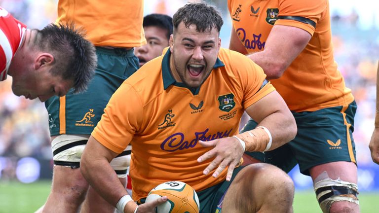 Australia's Massimo De Lutiis celebrates after becoming the 1,000th player capped by the Wallabies with a try on debut
