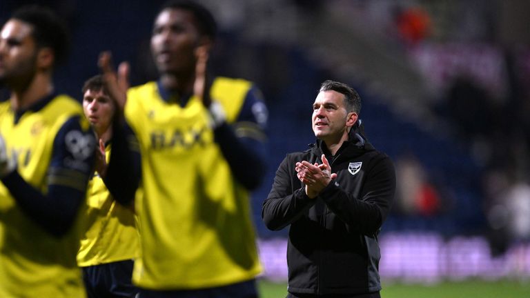 Matt Bloomfield applauds the Oxford fans after victory at Deepdale in March