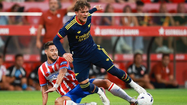 Max Dowman of Arsenal is tackled by Alex Moreno in Arsenal's game against Girona