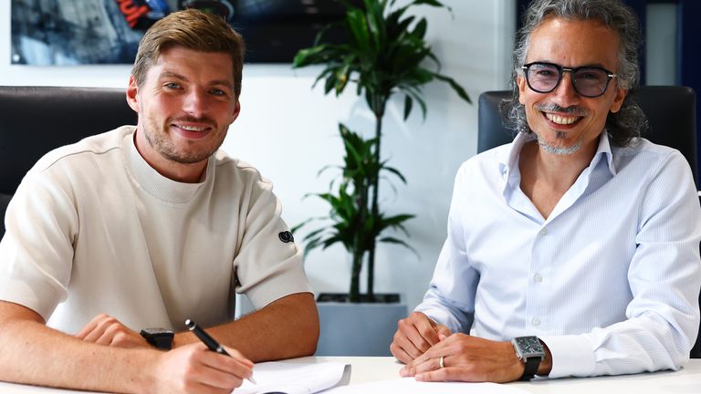 Max Verstappen and Laurent Mekies photographed during a re-signing of contracts, extending his deal with the team until 2030
