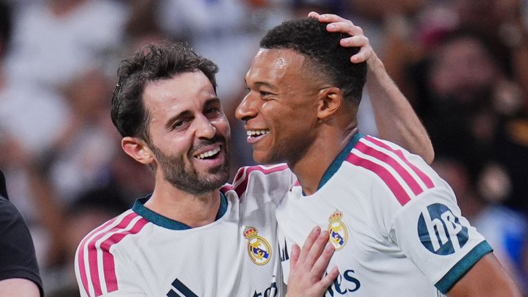 Real Madrid's Bernardo Silva, left, and Kylian Mbappe celebrate after scoring during the La Liga soccer match between Real Madrid and Real Sociedad in Madrid, Spain, Wednesday, Aug. 26, 2026. (AP Photo/Manu Fernandez)