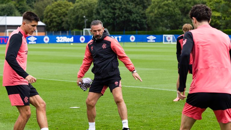 GLASGOW, SCOTLAND - AUGUST 19: Rangers Manager Derek McInnes (C) and Vanja Dragojevic (L) during a Rangers MD-1 Training Session at Rangers Training Centre, on August 19, 2026, in Glasgow, Scotland.  (Photo by Craig Foy / SNS Group)