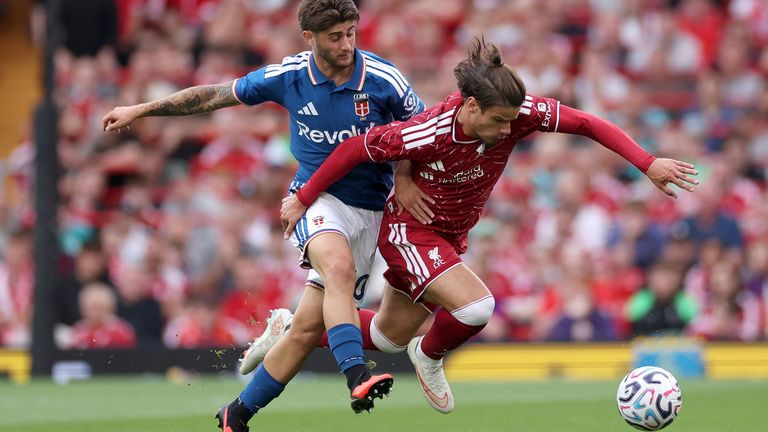 Milos Kerkez on the ball for Liverpool against Como at Anfield