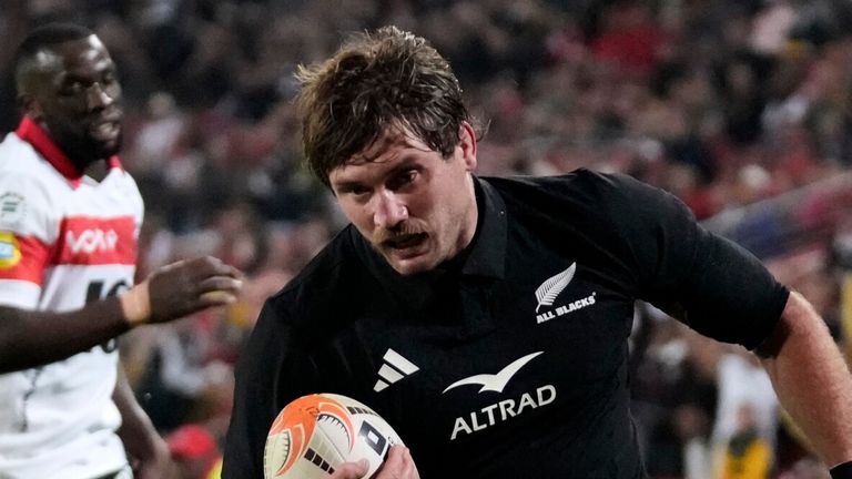 New Zealand's Ethan Blackadder scores a try during an international friendly rugby match between Lions and New Zealand, in Johannesburg, South Africa, Tuesday, Aug. 25, 2026. (AP Photo/Themba Hadebe)