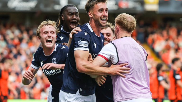 DUNDEE, SCOTLAND - AUGUST 22: Dundee's Owen Bevan (centre) celebrates with his teammates after scoring to make it 2-0 during a William Hill Premiership match between Dundee United and Dundee at The CalForth Construction Arena at Tannadice Park, on August 22, 2026, in Dundee, Scotland. (Photo by Craig Williamson / SNS Group)...