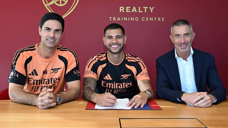 Bruno Guimaraes signs for Arsenal alongside manager Mikel Arteta and sporting director Andrea Berta