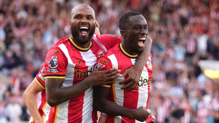 Michael Kayode celebrates scoring Brentford's third goal against Spurs with team-mate Igor Thiago