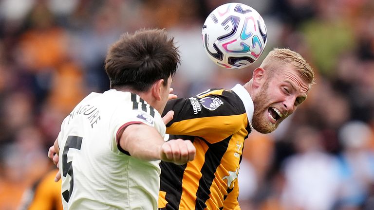 Harry Maguire and Oliver McBurnie battle for the ball