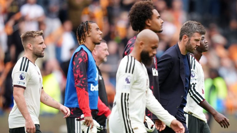Michael Carrick leads his players off the field following Manchester United's loss at Hull