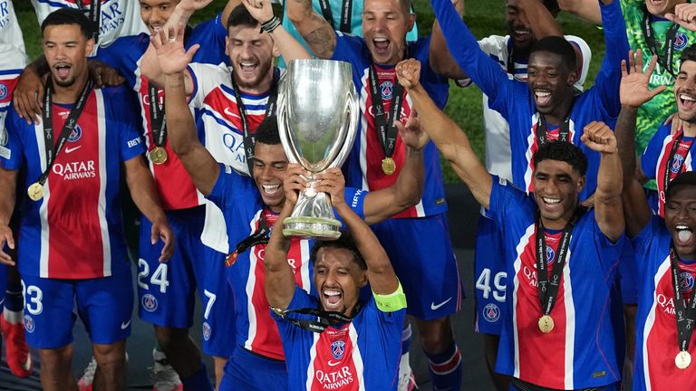PSG's Marquinhos lifts the trophy after the UEFA Super Cup match between Paris Saint-Germain and Aston Villa in Salzburg